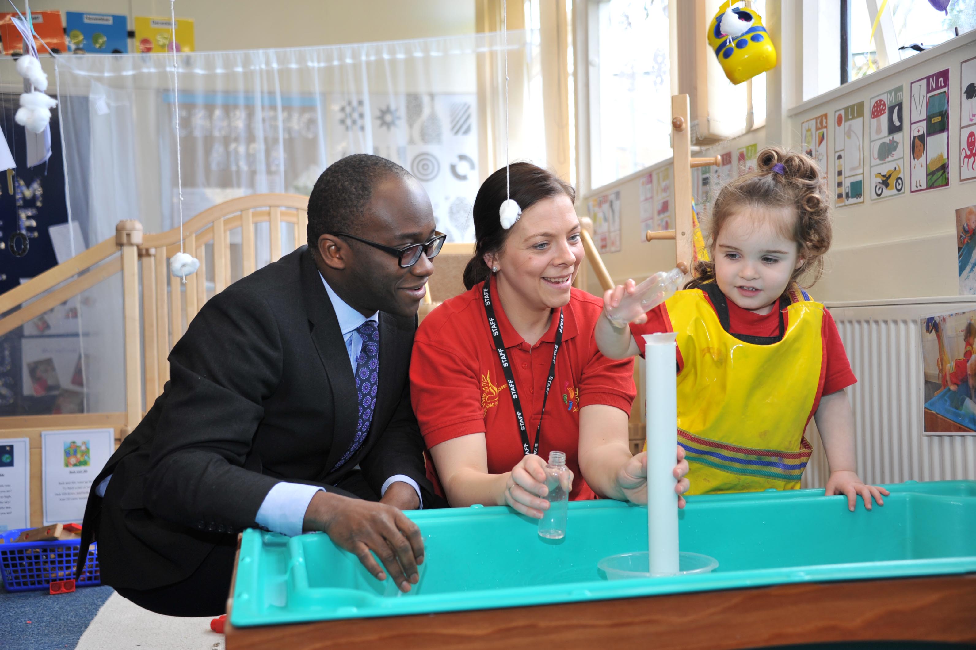 Education Minister Sam Gyimah with Sam Martin, neighbourhood development worker, and Imogen Sickling in the Tiny Steps provision for two-year-olds