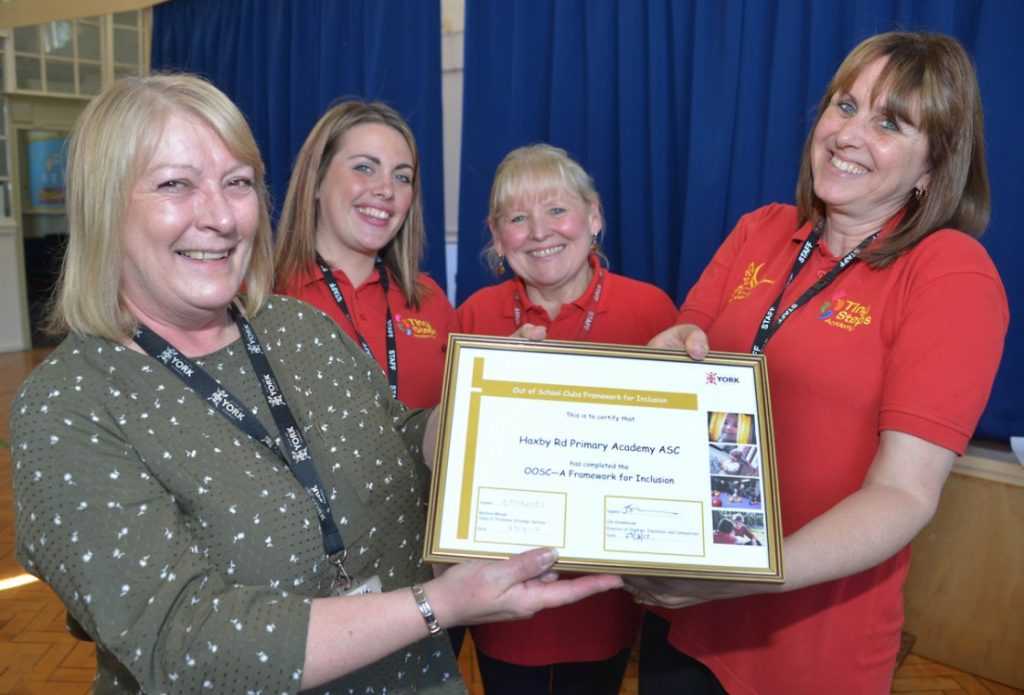 Debbie Adair, City of York Council’s Access & Inclusion Support Adviser (pictured left) presents the Gold Award to the Haxby Road Primary Academy Team (l-r) Lauren Powell, Diane Long and Fiona Stock.